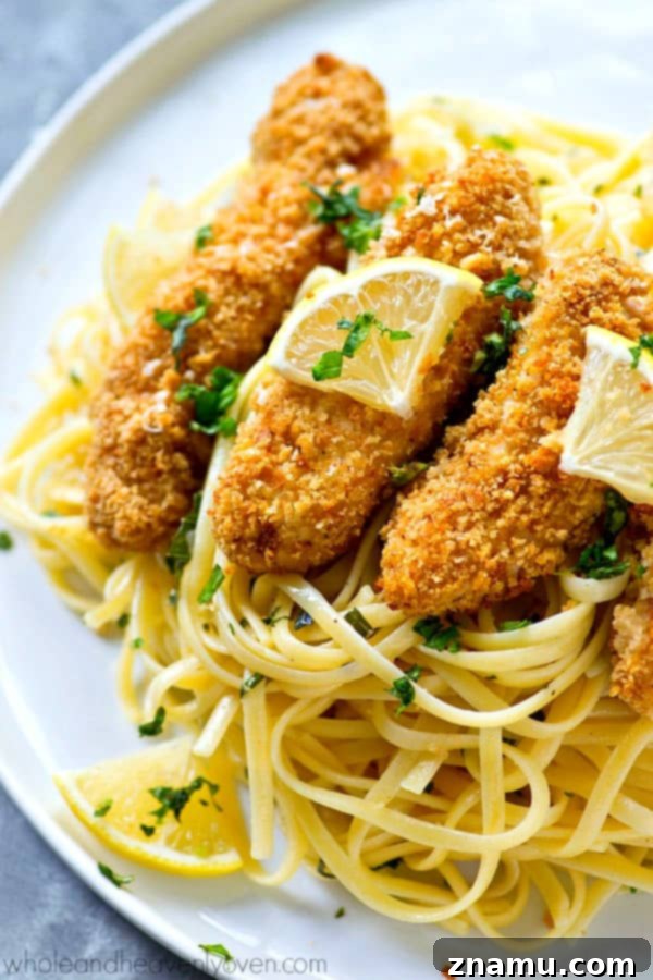 Crispy Lemon Parmesan Chicken Tenders with Aromatic Herb Pasta 4 Crispy lemon Parmesan baked chicken strips and buttery herb noodles make for one unbelievably fast and easy, yet totally insanely flavorful dinner that everyone will gladly gobble up!