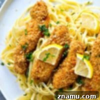 Crispy Lemon Parmesan Chicken Tenders with Aromatic Herb Pasta 9 Crispy lemon Parmesan baked chicken strips and buttery herb noodles make for one unbelievably fast and easy, yet totally insanely flavorful dinner that everyone will gladly gobble up!