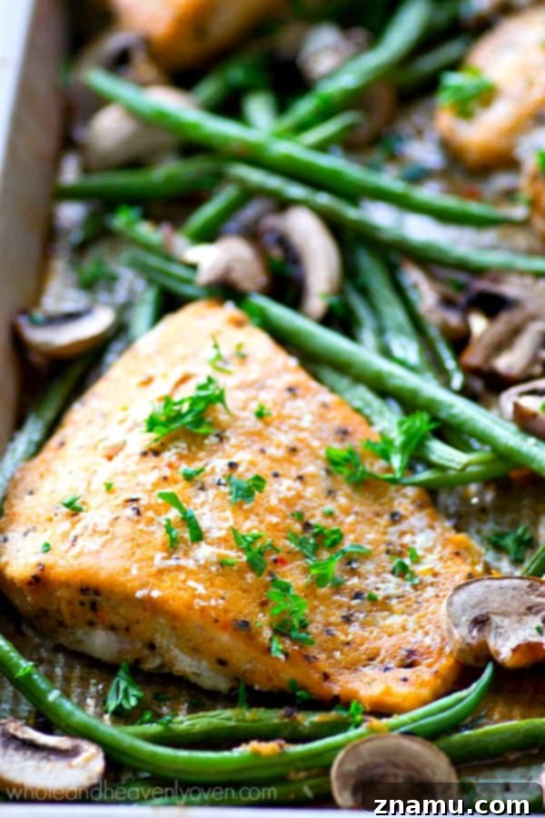 One Pan Lemon Garlic Parmesan Salmon with Green Beans and Mushrooms 3 Roasted in a flavorful lemon garlic Parmesan Parmesan sauce and lots of little mushrooms and green beans, this baked salmon is a breeze to throw together for a weeknight dinner and is packed with SO many amazing flavors!
