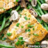 One Pan Lemon Garlic Parmesan Salmon with Green Beans and Mushrooms 7 Roasted in a flavorful lemon garlic Parmesan sauce and lots of little mushrooms and green beans, this baked salmon is a breeze to throw together for a weeknight dinner and is packed with SO many amazing flavors!
