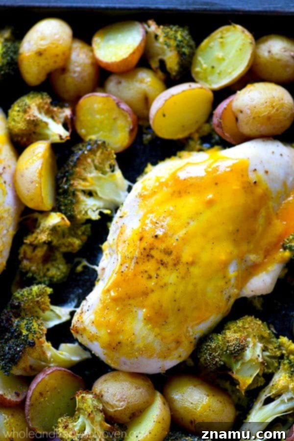 Sheet Pan Honey Mustard Chicken with Roasted Fingerlings and Broccoli 6 A serving of one-pan honey mustard chicken, potatoes, and broccoli on a plate