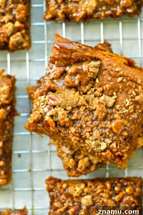 Spiced Pumpkin Caramel Crumble Bars 4 Pumpkin crumb bars cooling on a wire rack, ready for caramel
