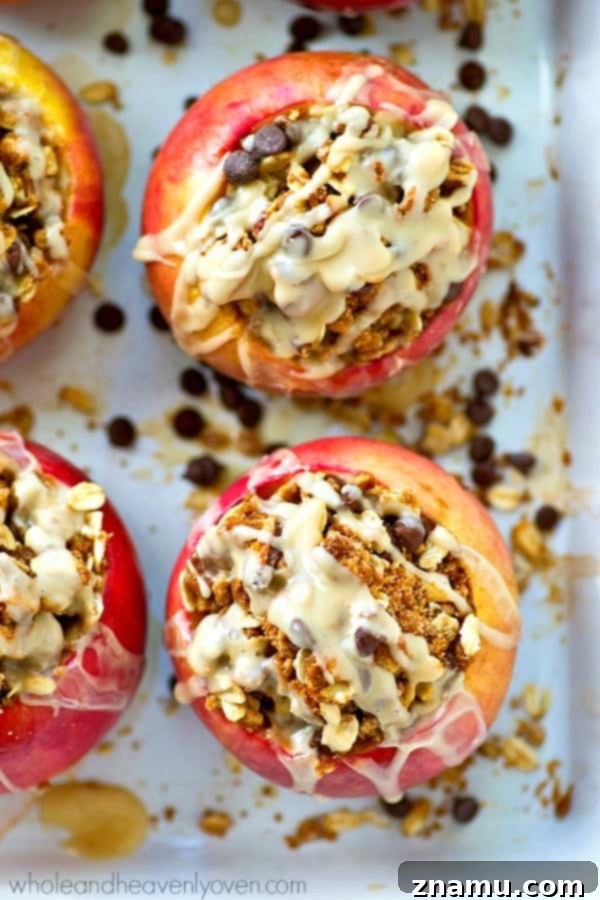 Chocolate Chip Iced Oatmeal Baked Apples 5 Irresistible iced baked apple, showcasing the gooey chocolate chip cookie center and a rich frosting.