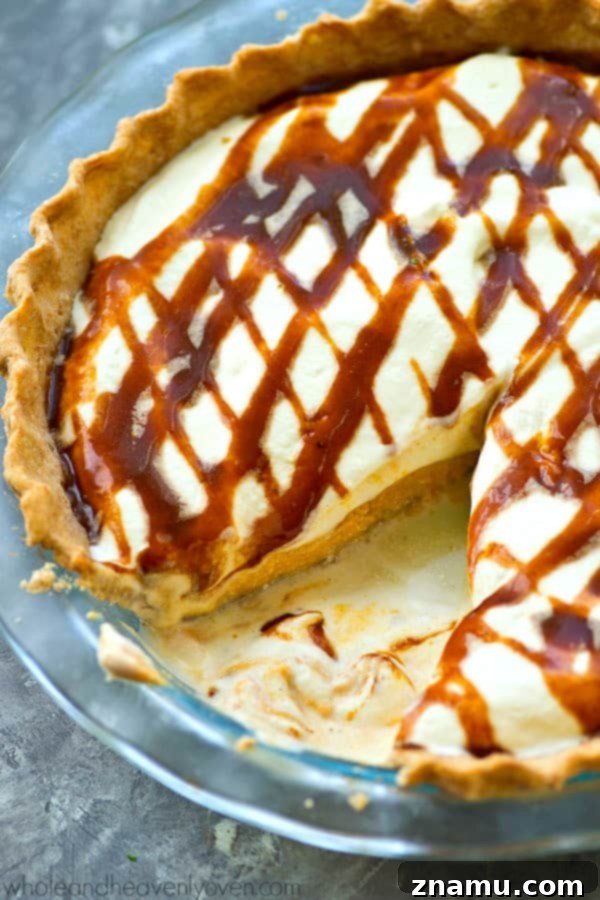 Decadent No-Bake Caramel Pumpkin Cheesecake 4 No-Bake Caramel Cheesecake Pumpkin Pie displayed on a rustic wooden table, ready to be served