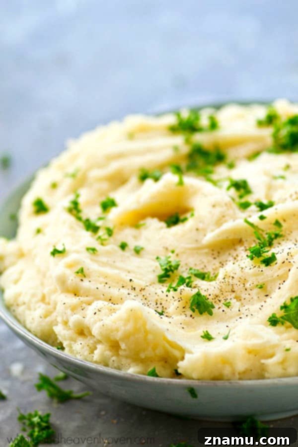 The Ultimate Creamy Garlic Whipped Potatoes 4 Overhead shot of a bowl of creamy mashed potatoes, ready to be served, highlighting their smooth consistency and inviting texture.