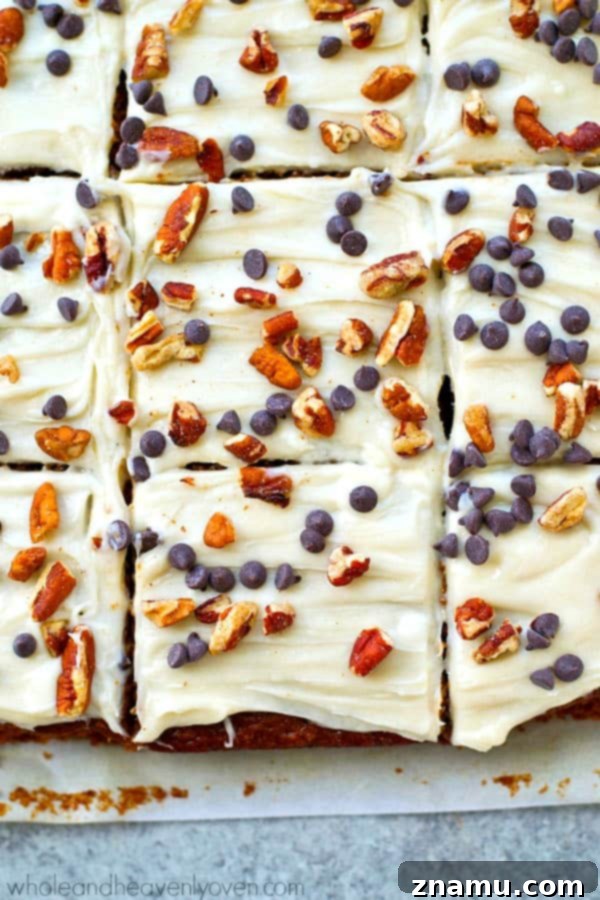 Enjoying these super-soft and spicy gingerbread cake bars with chocolate chips and cream cheese frosting as an easy holiday dessert.