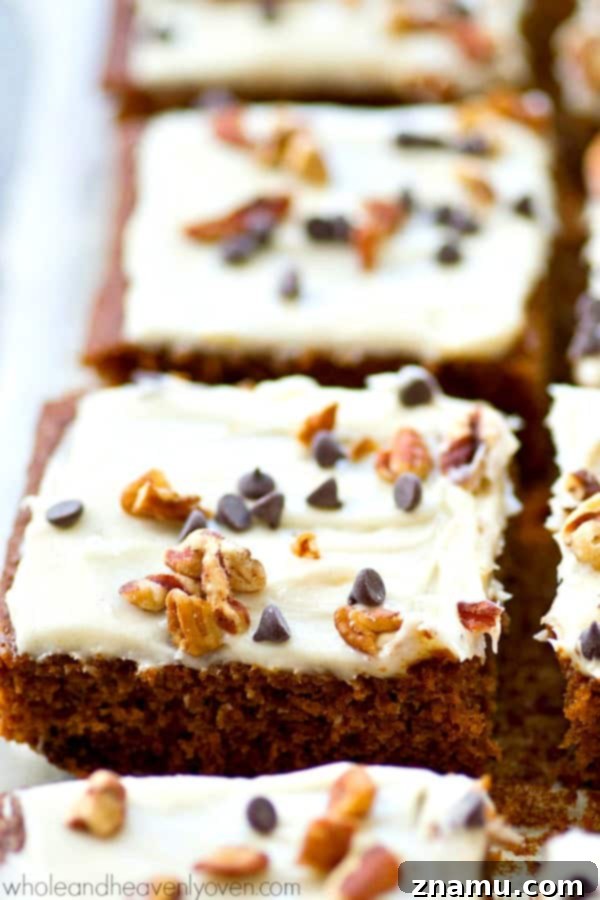 Delicious gingerbread chocolate chip cake bars topped with a thick layer of cream cheese frosting.