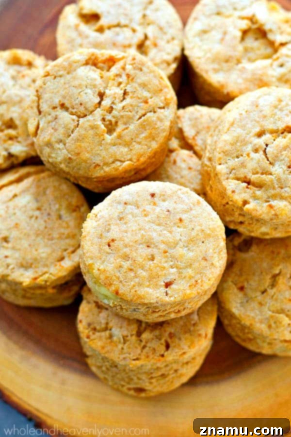 Fluffy Cheesy Potato Coconut Oil Biscuits 6 A stack of golden, flaky cheesy mashed potato biscuits.