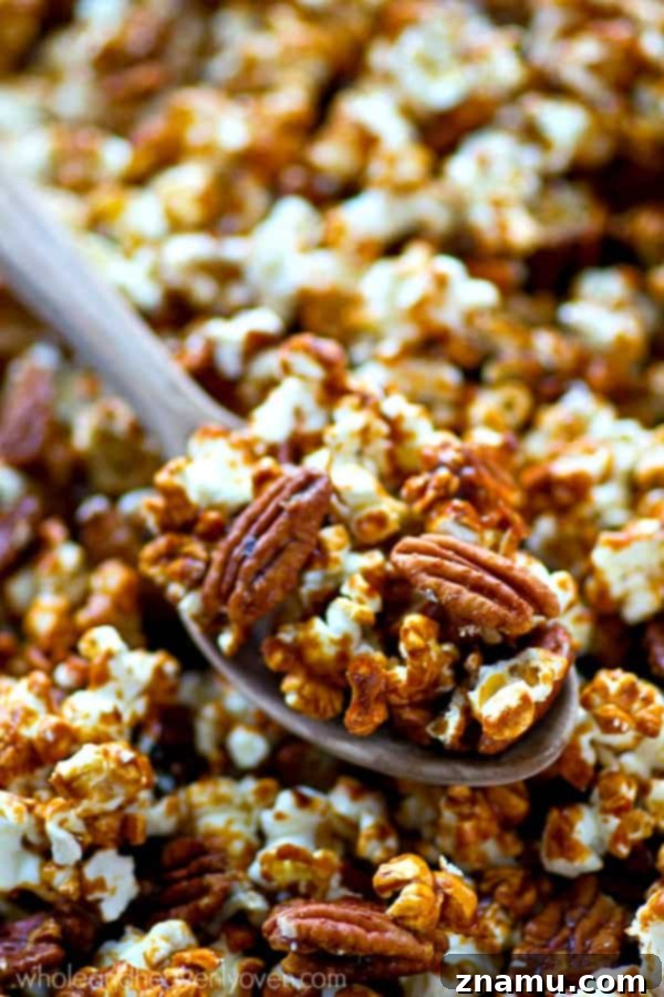 Pecan Praline Cinnamon Popcorn 5 A bowl of Cinnamon Roll Pecan Caramel Popcorn, perfect for sharing during festive occasions