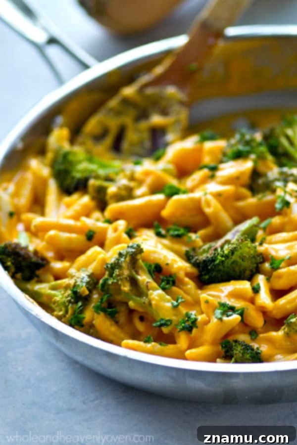 Creamy Butternut Squash and Roasted Broccoli Penne Skillet 3 Close-up of creamy alfredo penne with perfectly roasted broccoli florets and golden butternut squash for a wholesome meal.