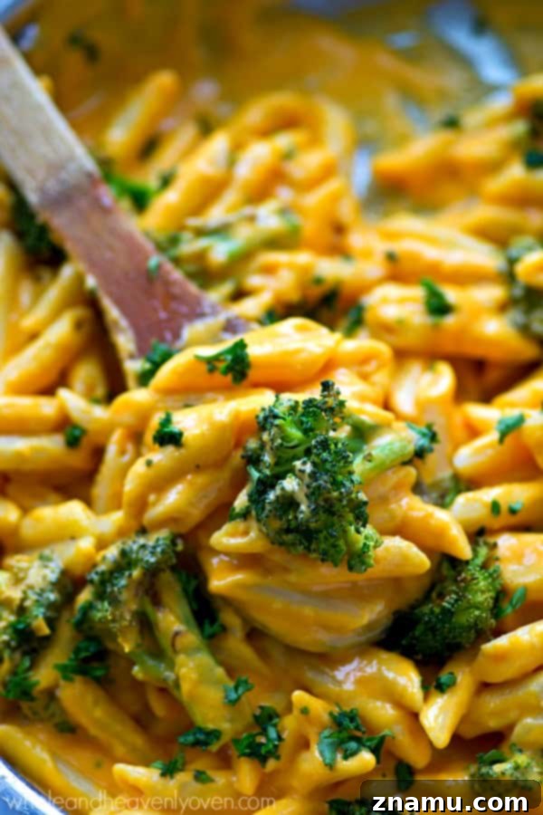Creamy Butternut Squash and Roasted Broccoli Penne Skillet 4 A generous serving of butternut squash alfredo penne skillet, showcasing the rich, creamy sauce and tender ingredients.