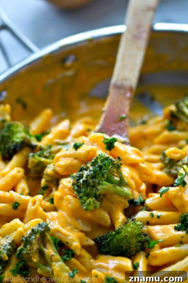 Creamy Butternut Squash and Roasted Broccoli Penne Skillet 7 A skillet filled with Butternut Squash Roasted Broccoli Alfredo Penne, garnished with fresh parsley, ready to be enjoyed.