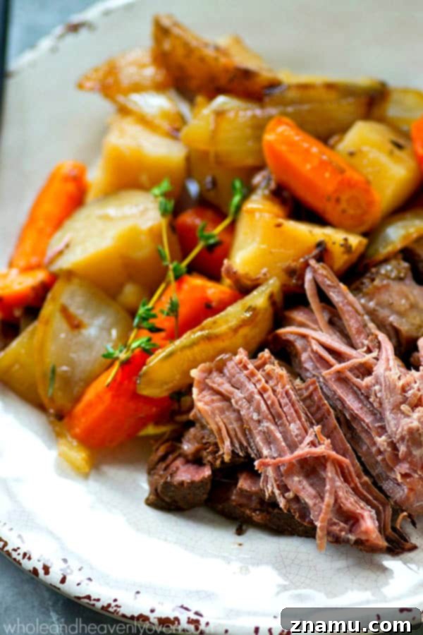 Slow-Cooked Balsamic Pot Roast with Sweet Caramelized Onions and Roasted Potatoes 5 Cooked Balsamic Pot Roast with tender beef, soft vegetables, and a rich sauce