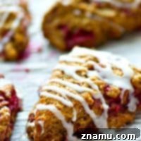 Sweet Glazed Raspberry Eggnog Scone Bites 9 A small image of delicious mini eggnog scones with raspberry, ready for baking.