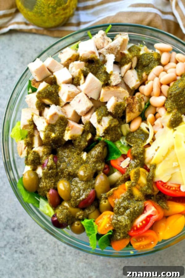 A Taste of Tuscany: Turkey & Pesto Salad 2 A beautifully presented Tuscan-style turkey salad, generously topped with fresh ingredients and a rich pesto vinaigrette.