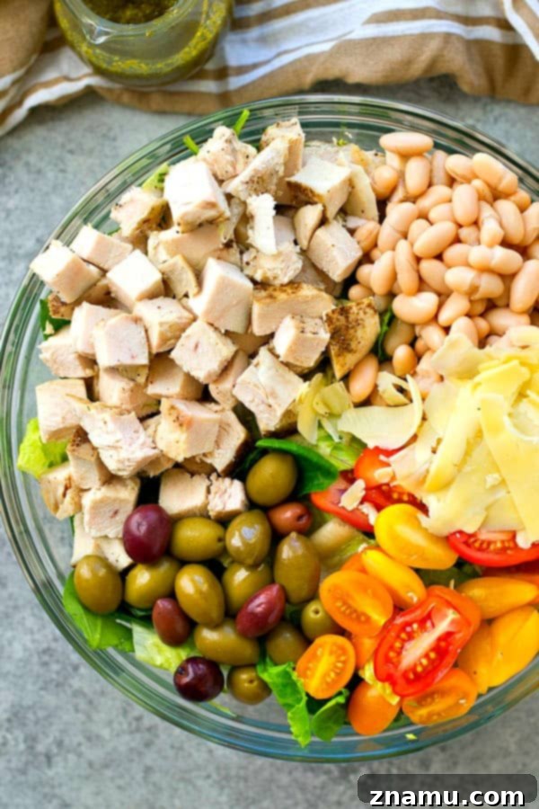 A Taste of Tuscany: Turkey & Pesto Salad 6 A large serving bowl filled with the colorful Tuscan turkey salad, invitingly ready to be dressed and enjoyed.