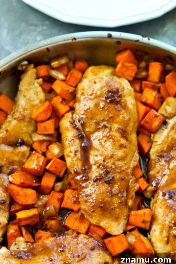 Sticky Maple Chicken & Sweet Potato Hash 5 Freshly seared chicken breasts alongside diced sweet potatoes and onions in a skillet.