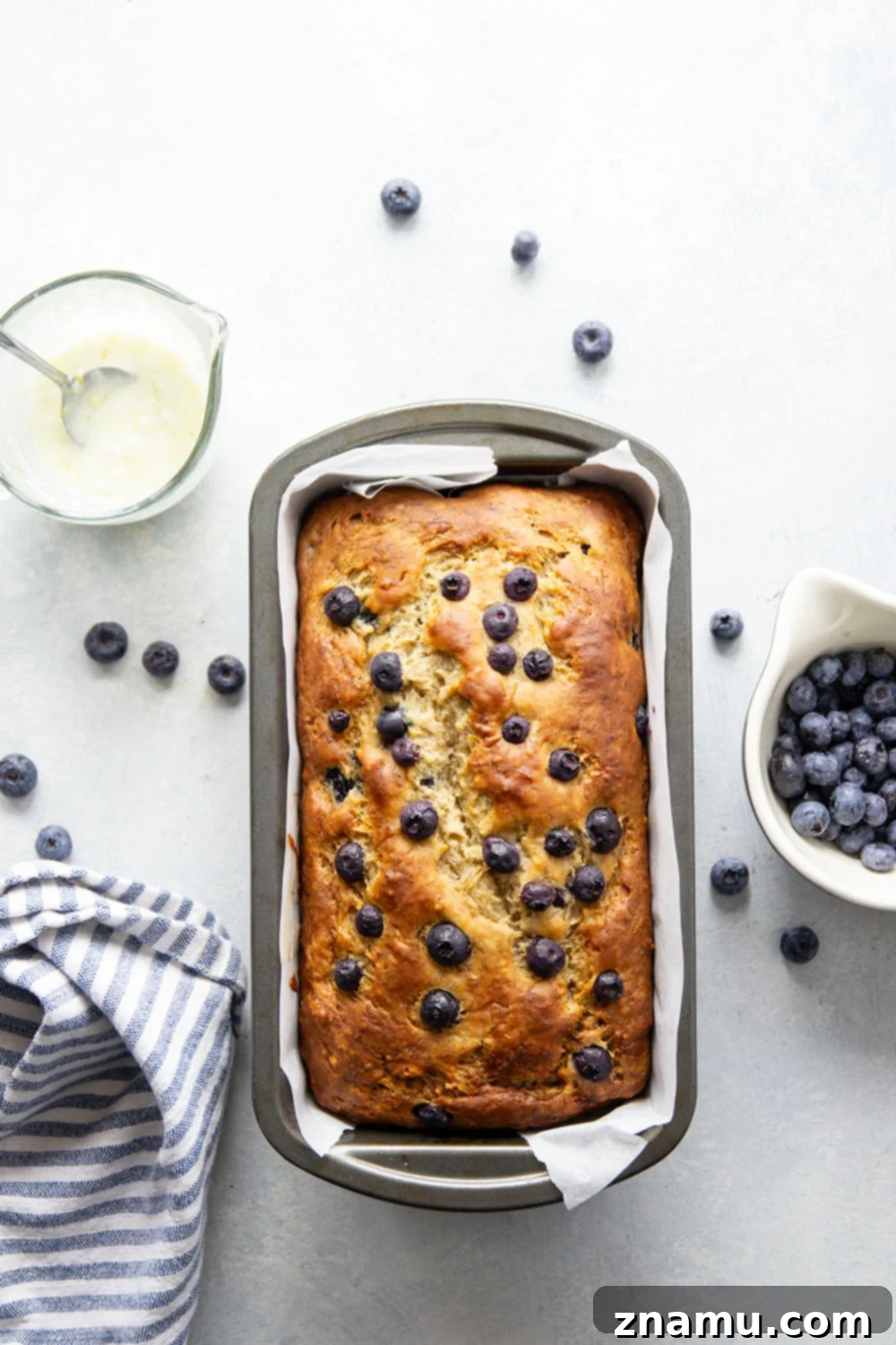 Sunshine Blueberry Banana Bread with Zesty Citrus Glaze 3 Slice of blueberry banana bread showing moist interior and blueberries