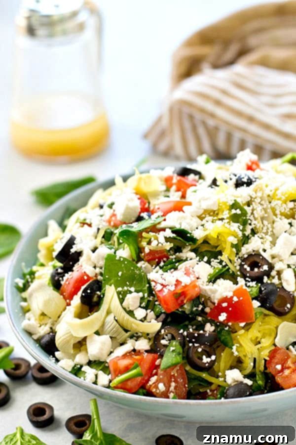 Greek salad gets a fun makeover with the addition of spaghetti squash and an incredible lemon-y garlic vinaigrette. This easy spaghetti squash salad is practically a meal in itself!