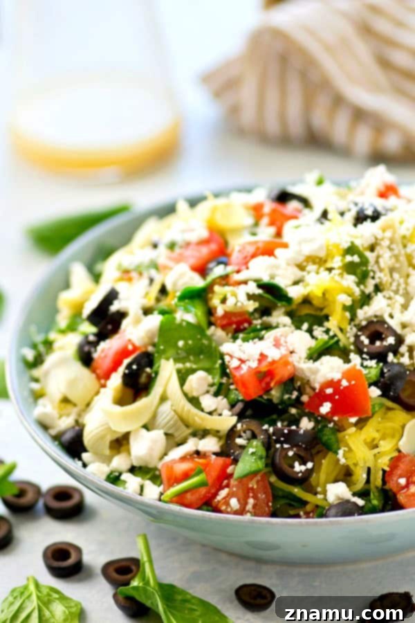 Greek salad gets a fun makeover with the addition of spaghetti squash and an incredible lemon-y garlic vinaigrette. This easy spaghetti squash salad is practically a meal in itself!