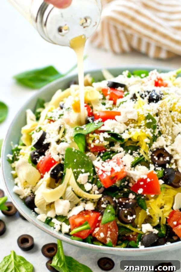 Greek salad gets a fun makeover with the addition of spaghetti squash and an incredible lemon-y garlic vinaigrette. This easy spaghetti squash salad is practically a meal in itself!