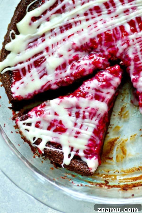 Decadent Flourless Mocha Raspberry White Chocolate Pie 2 Rich, fudgy flourless mocha chocolate raspberry pie, elegantly garnished with white chocolate drizzle