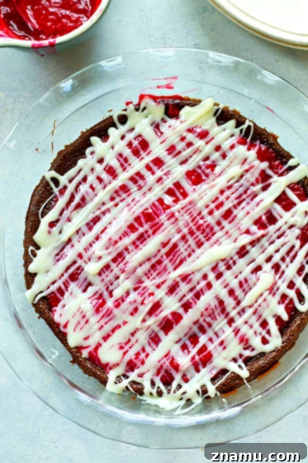 Decadent Flourless Mocha Raspberry White Chocolate Pie 4 The rich, dark chocolate flourless pie base cooling on a wire rack, waiting for the vibrant raspberry topping