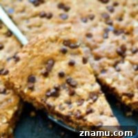 NO butter in this insanely-soft and chewy oatmeal chocolate chip skillet cookie! The dough mixes up in one bowl and it all bakes up in one skillet for whenever you get that warm cookie craving!
