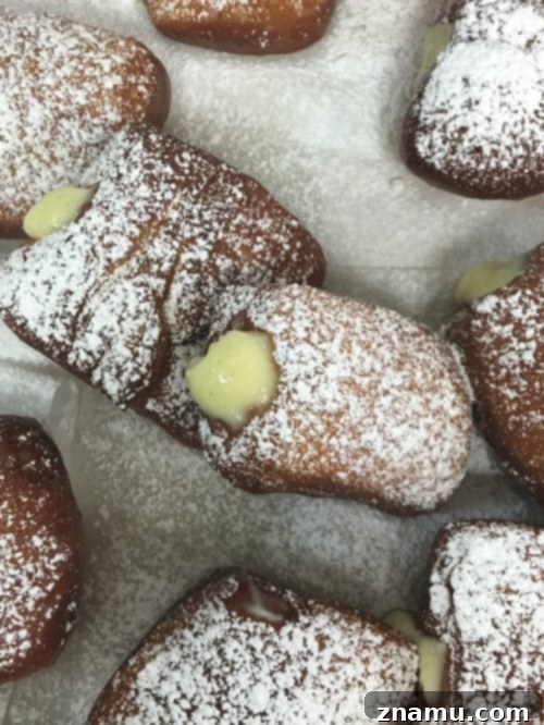 The Culinary Crucible: Volume Three 14 A tray of freshly fried and glazed donuts