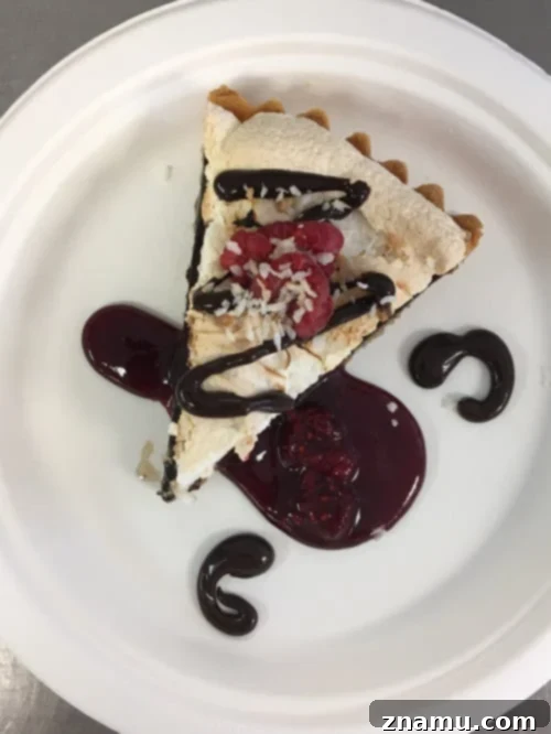 The Culinary Crucible: Volume Three 24 Proud chef holding up a baked tart with a decorative meringue topping