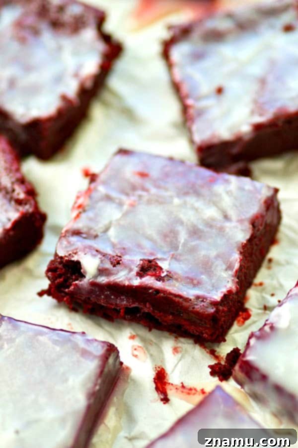 Close-up of fluffy White Chocolate Red Velvet Brownie Bites on a cooling rack