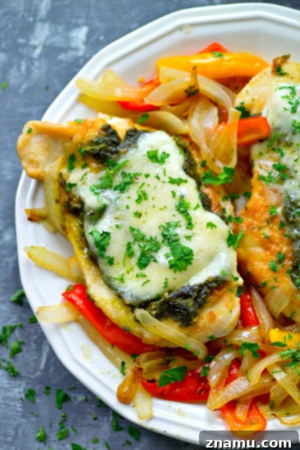 Pan-seared basil pesto chicken breasts get topped with a homemade basil pesto and lots of mozzarella cheese for an easy skillet chicken dinner ready in under 30 minutes!