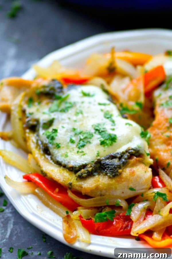 Pan-seared basil pesto chicken breasts get topped with a homemade basil pesto and lots of mozzarella cheese for an easy skillet chicken dinner ready in under 30 minutes!