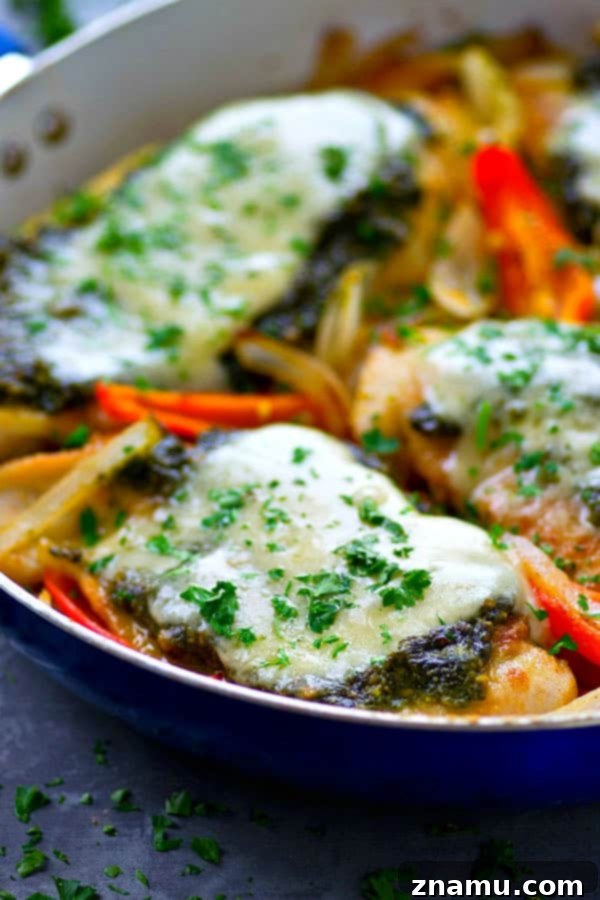 Pan-seared basil pesto chicken breasts get topped with a homemade basil pesto and lots of mozzarella cheese for an easy skillet chicken dinner ready in under 30 minutes!