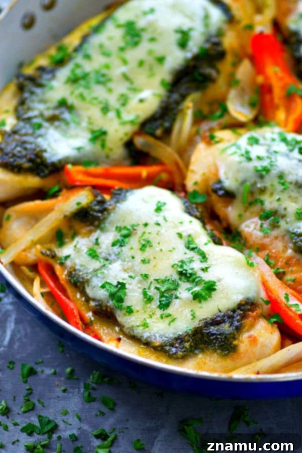 Pan-seared basil pesto chicken breasts get topped with a homemade basil pesto and lots of mozzarella cheese for an easy skillet chicken dinner ready in under 30 minutes!