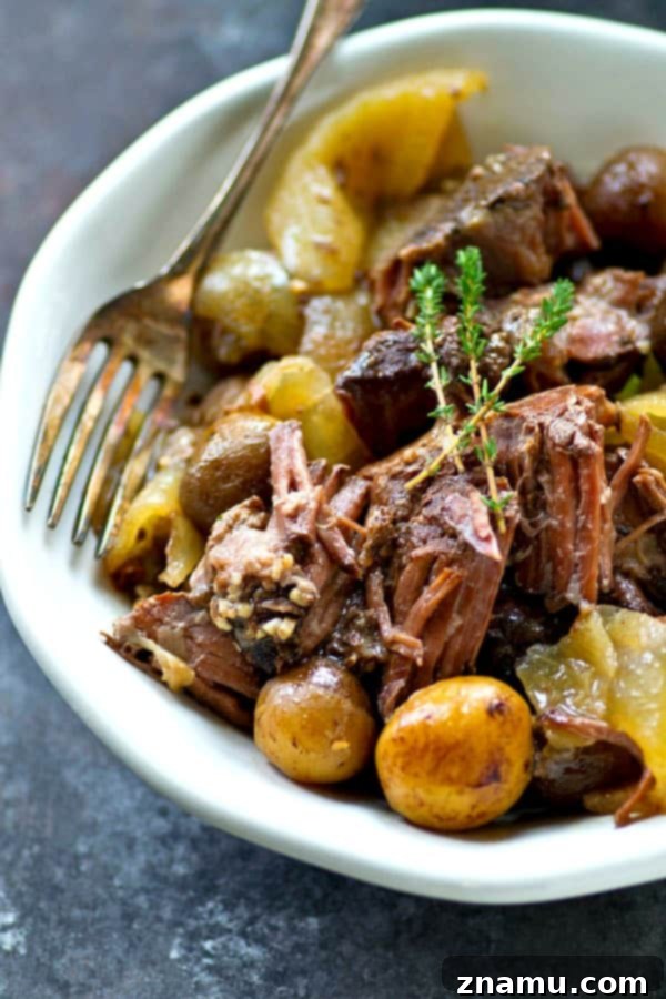 Rustic Wine-Braised Beef with Fingerling Potatoes 6 Cooked crockpot beef and fingerling potatoes on a serving platter