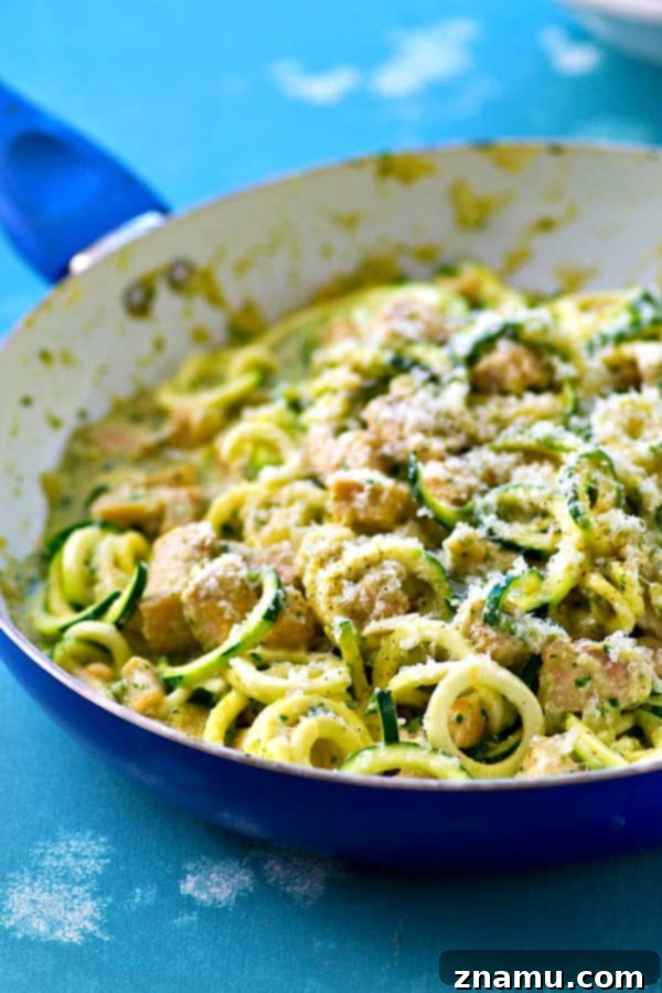 Creamy One-Pot Pesto Chicken Zoodles Alfredo 6 Pesto Chicken Alfredo Zucchini Noodles garnished with fresh herbs