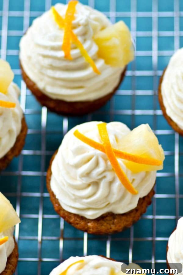 Pineapple Banana Paradise with Zesty Cream Cheese 5 Pineapple Banana Cupcake being frosted with tangy citrus cream cheese.
