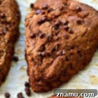 Packed with a double-whammy of chocolate and SO easy to whip up, these flaky coconut oil scones will quickly become a weekend breakfast favorite. Make a double batch for the freezer!