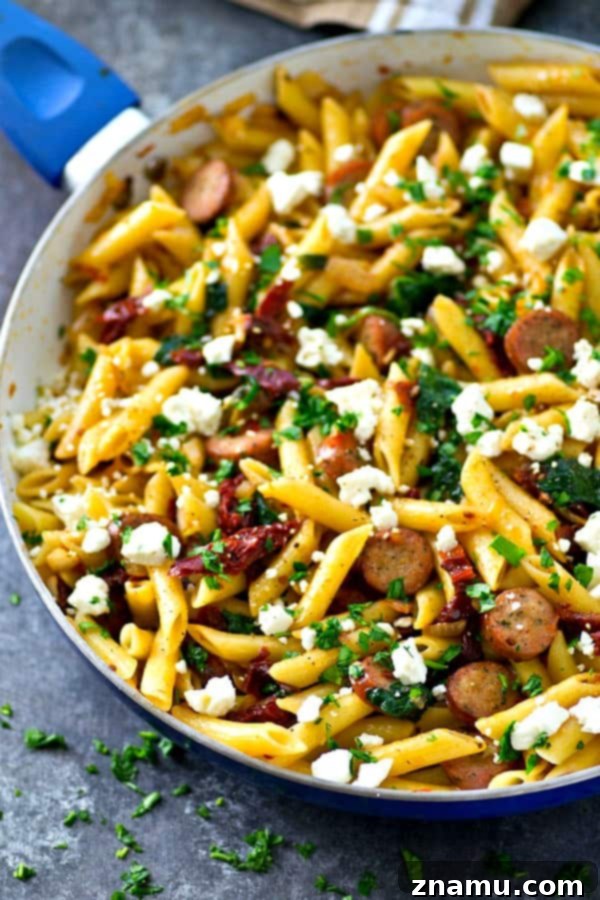 One-Pan Sun-Dried Tomato Sausage & Feta Penne 2 Delicious Sun-Dried Tomato Penne Skillet with sausage, feta, and spinach, perfect for a quick weeknight dinner