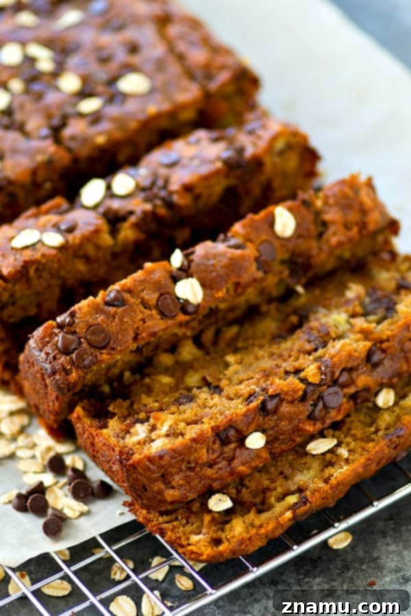 Decadent Oatmeal Chocolate Chip Cookie Banana Bread 6 Close-up of the crust of the Oatmeal Chocolate Chip Banana Bread, rich in texture and color.