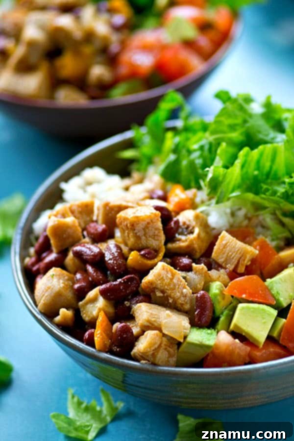 Southwest Chipotle Chicken Bowls 6 A beautifully arranged Chipotle Chicken & Beans Rice Salad Bowl with all toppings