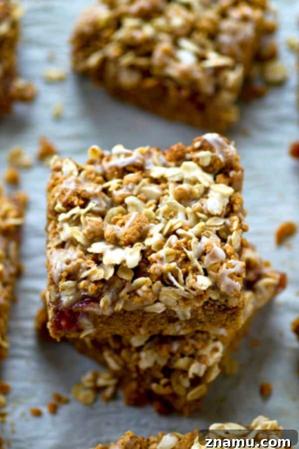 Freshly baked PB&J cookie bars cooling on a wire rack before glazing.