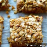 These loaded cookie bars are a peanut butter and jelly lover's dream! An oatmeal streusel topping and tons of glaze drizzled on top make them so fun and kid-friendly.