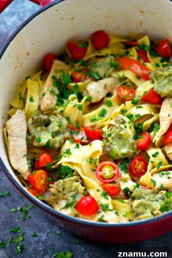 Speedy Skillet Chicken Fajita Fettuccine 4 Serving of One-Pot Chicken Fajita Fettuccine Skillet topped with guacamole, tomatoes, and parsley.