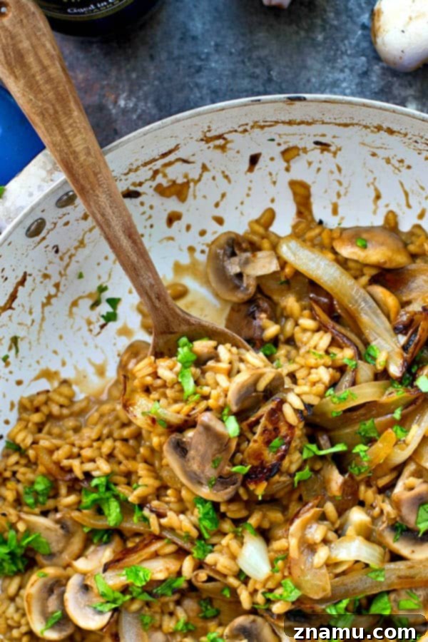 Sautéing onions and mushrooms in a skillet for risotto