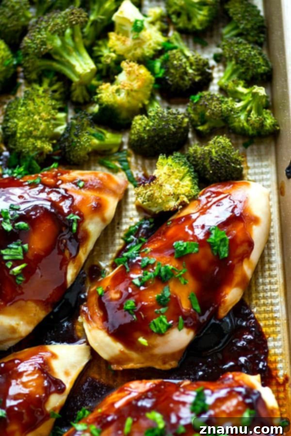 One-Pan Teriyaki Chicken and Roasted Broccoli 5 Chicken breasts and broccoli florets ready for baking on a single sheet pan with teriyaki glaze.