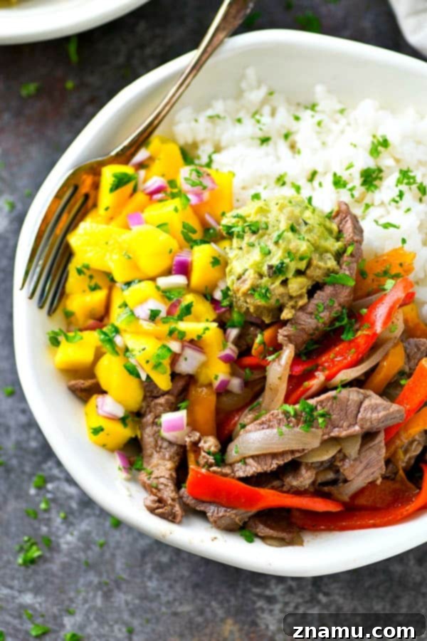 Steak and Peppers Rice Bowls with Mango Pico de Gallo 2 Delicious Steak and Peppers Rice Bowl with vibrant mango pico de gallo, a perfect weeknight meal.