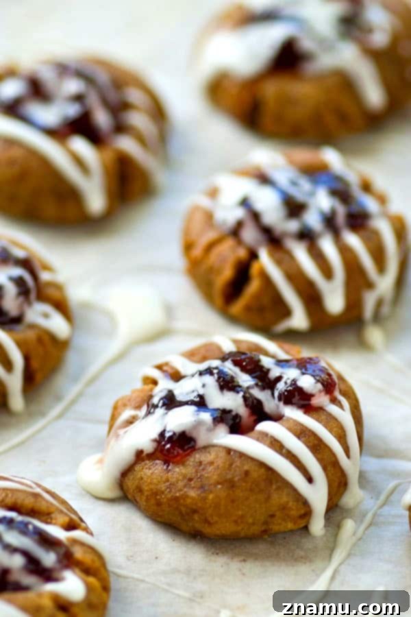 Blueberry Pie Thumbprint Jewels 2 Buttery shortbread cookies are filled with a homemade blueberry pie filling and drizzled with tons of glaze.---it's impossible to only eat one of these thumbprint cookies!