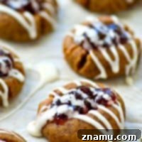 Blueberry Pie Thumbprint Jewels 8 Buttery shortbread cookies are filled with a homemade blueberry pie filling and drizzled with tons of glaze.---it's impossible to only eat one of these thumbprint cookies!